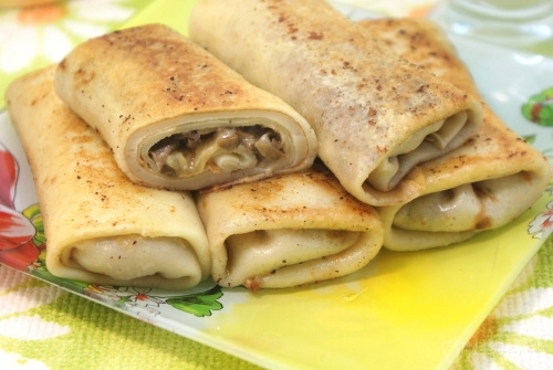 Фаршированные блины с грибами и сыром